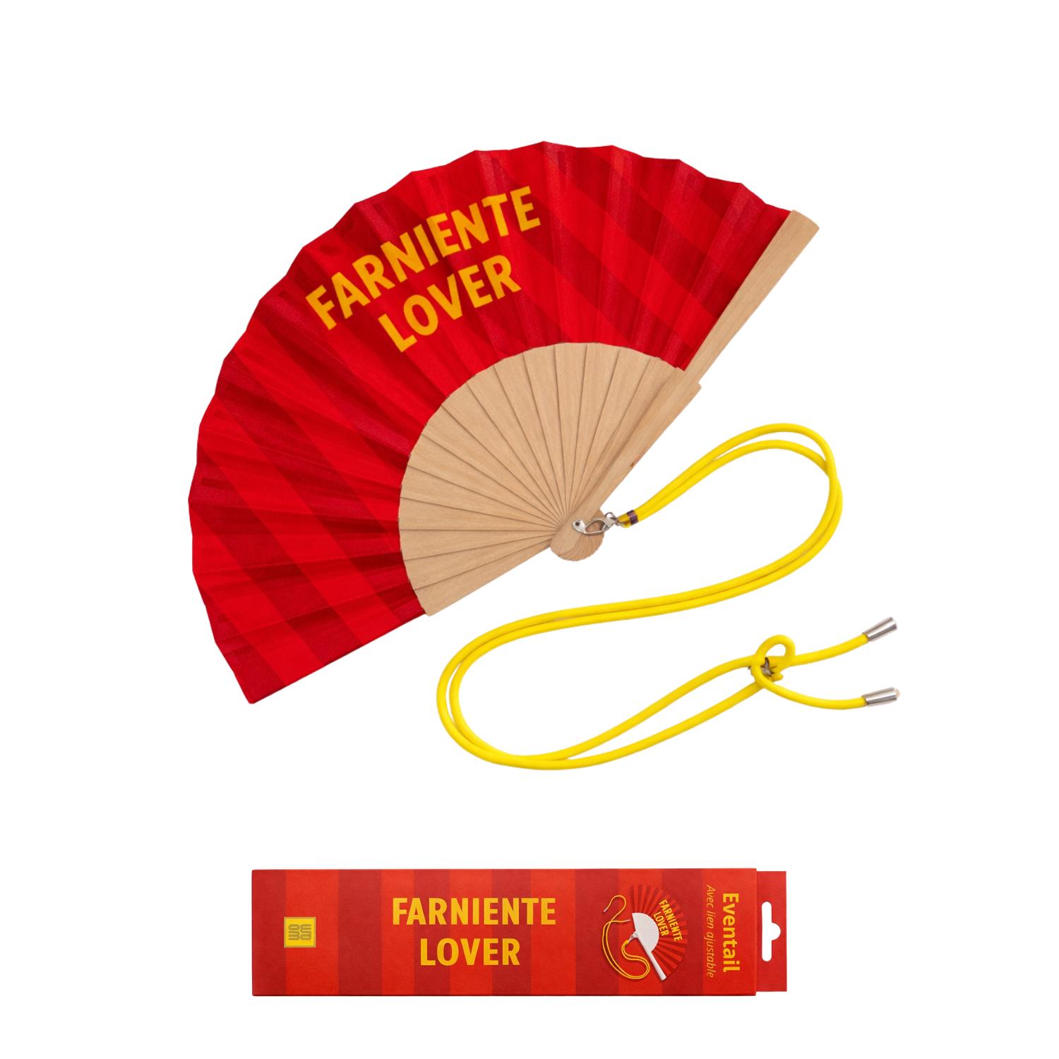 Éventail Farniente Lovers présenté avec sa boîte cadeau assortie, au design graphique rouge et jaune, prêt à offrir.
