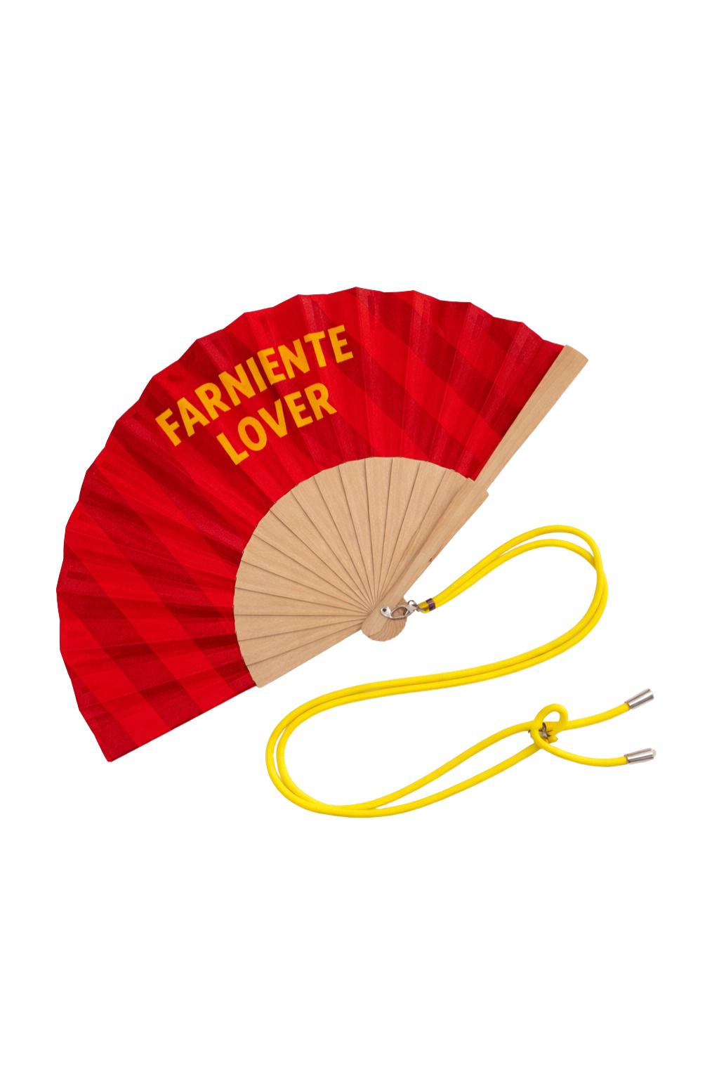Éventail Farniente Lovers présenté avec sa boîte cadeau assortie, au design graphique rouge et jaune, prêt à offrir.
